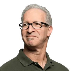 Portrait of a man wearing glasses and a dark shirt